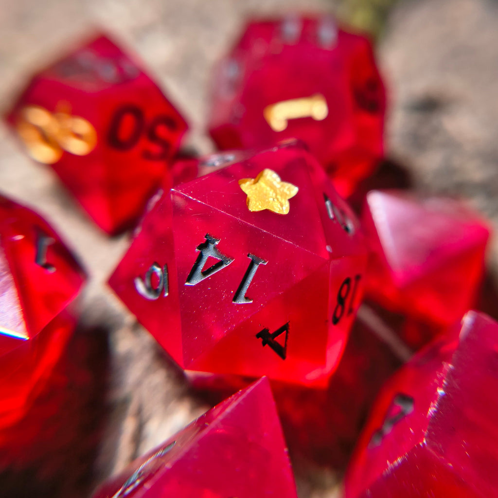 Close-up of red polyhedral dice on a wood surface