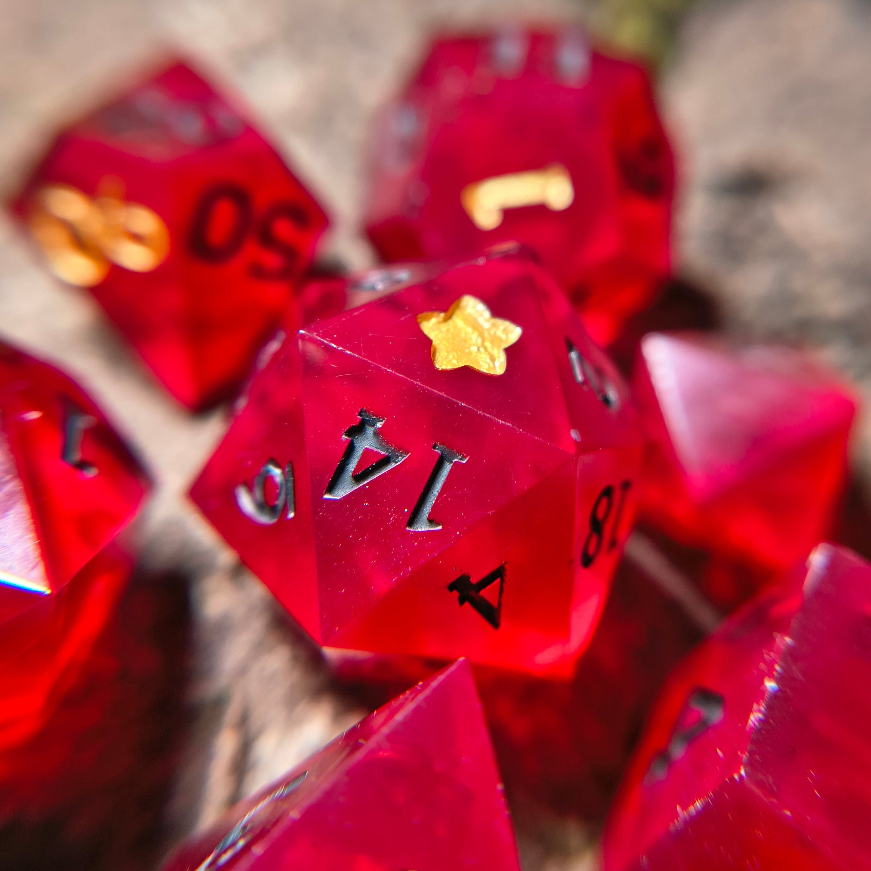 Close-up of red polyhedral dice on a wood surface